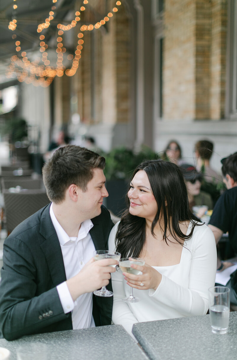 couple-drinking-champagne-engagement-session