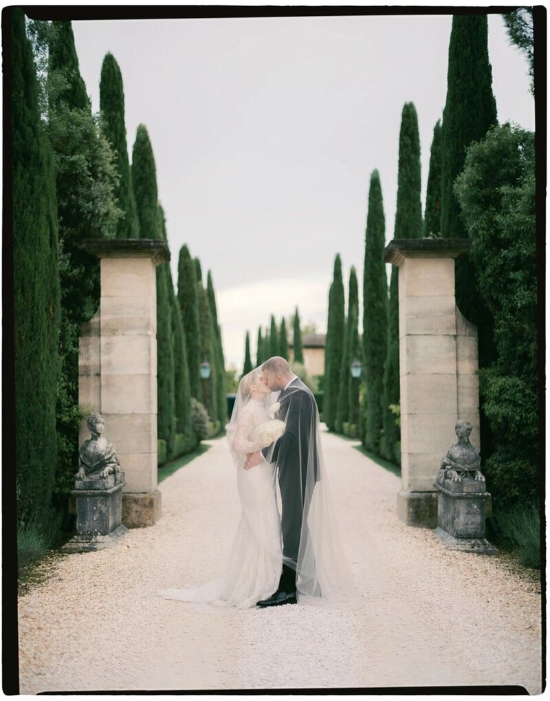 Wedding couple embracing at their villa del Balbianello wedding ceremony, by Lake Como wedding photographer Andreas K. Georgiou