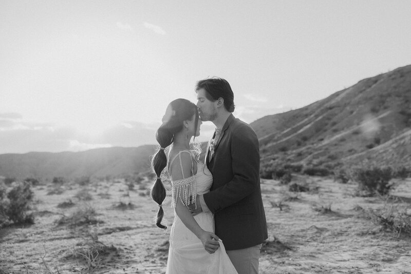 bride and groom riding horses