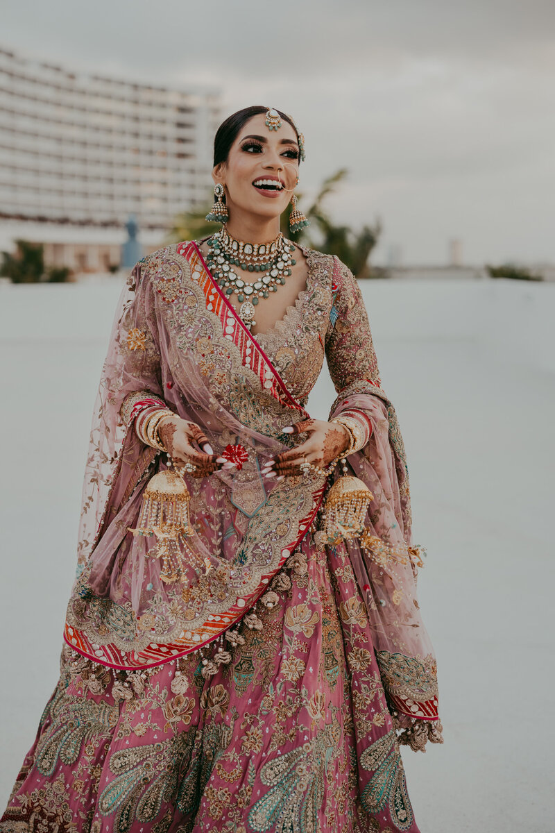 Bride with glittery dress walking down stairs