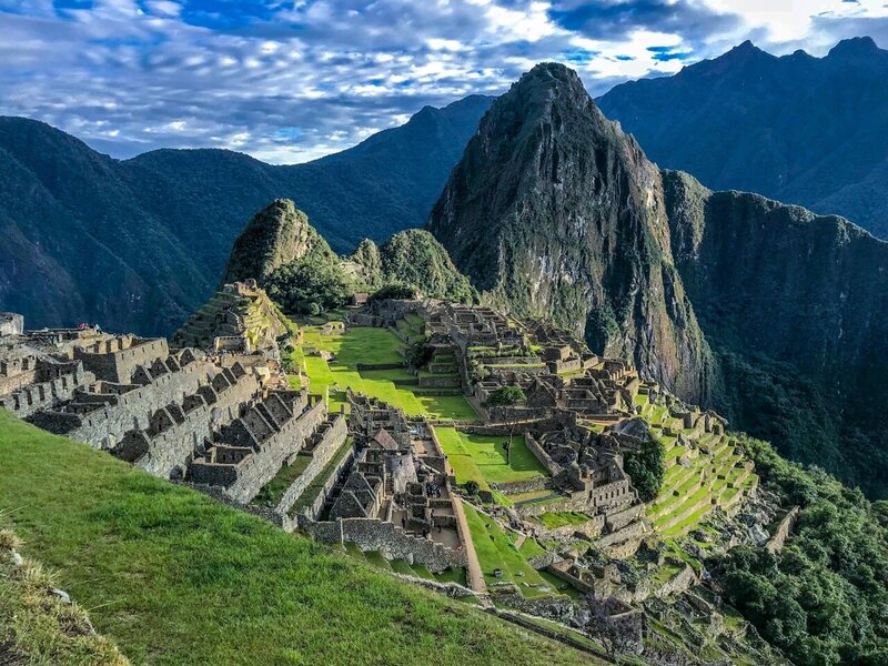 Scenic view of Machu Picchu ruins in Peru surrounded by Andes Mountains