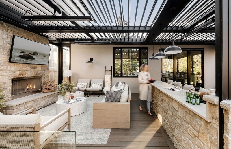 An outdoor living space with a suncoast enclosure and outdoor furniture. 