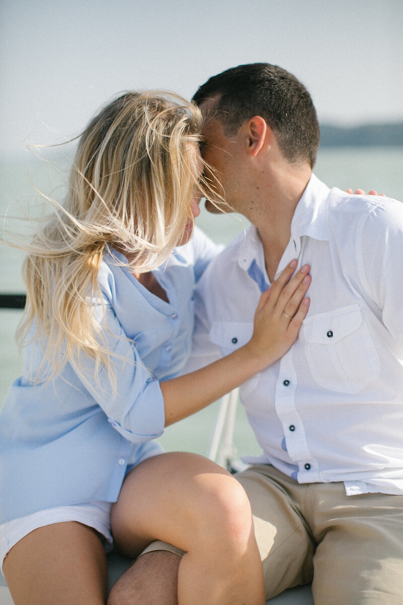 Engagement session by the sea with couple embracing – intimate destination photography in Capri, Italy