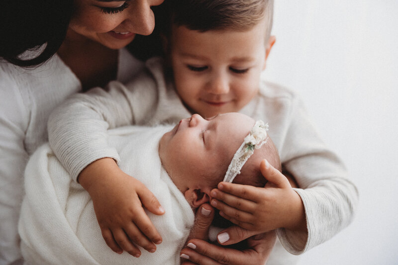In-studio newborn photographer in Indianapolis, IN - sleeping newborn girl with pink wrap