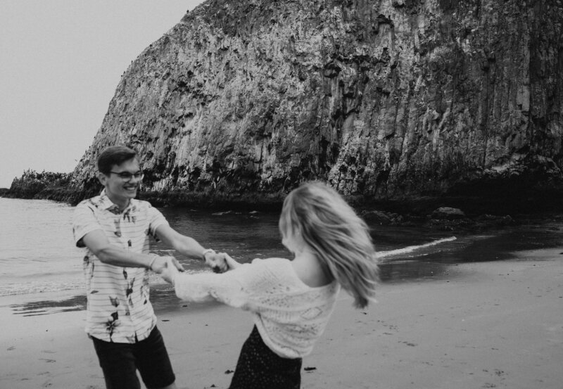 Out-of-state couple exploring the Oregon Coast at Seal Rock, Oregon, enjoying the natural beauty of the coastal landscape.