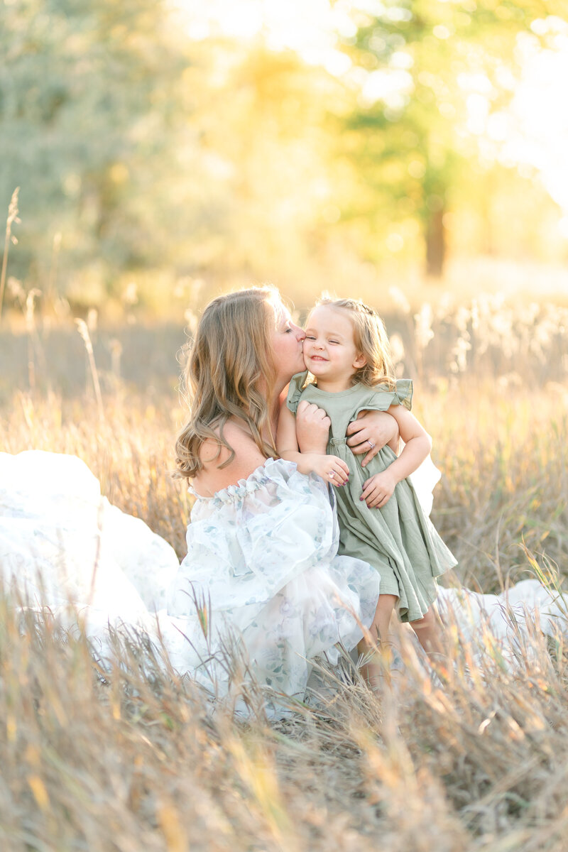 Outdoor family photography in Utah with a beautiful sunset backdrop, captured by kamee-valdez-photo