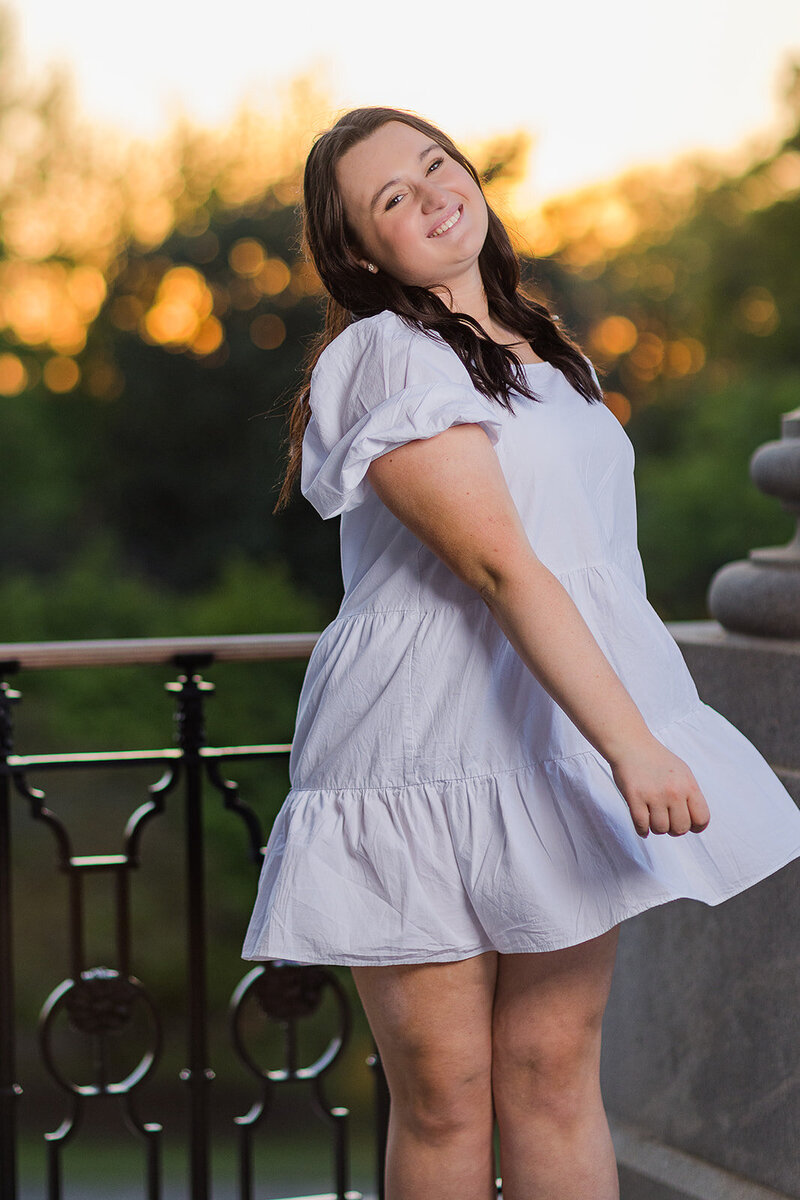 A girl taking her senior portrait in downtown Columbia, South Carolina