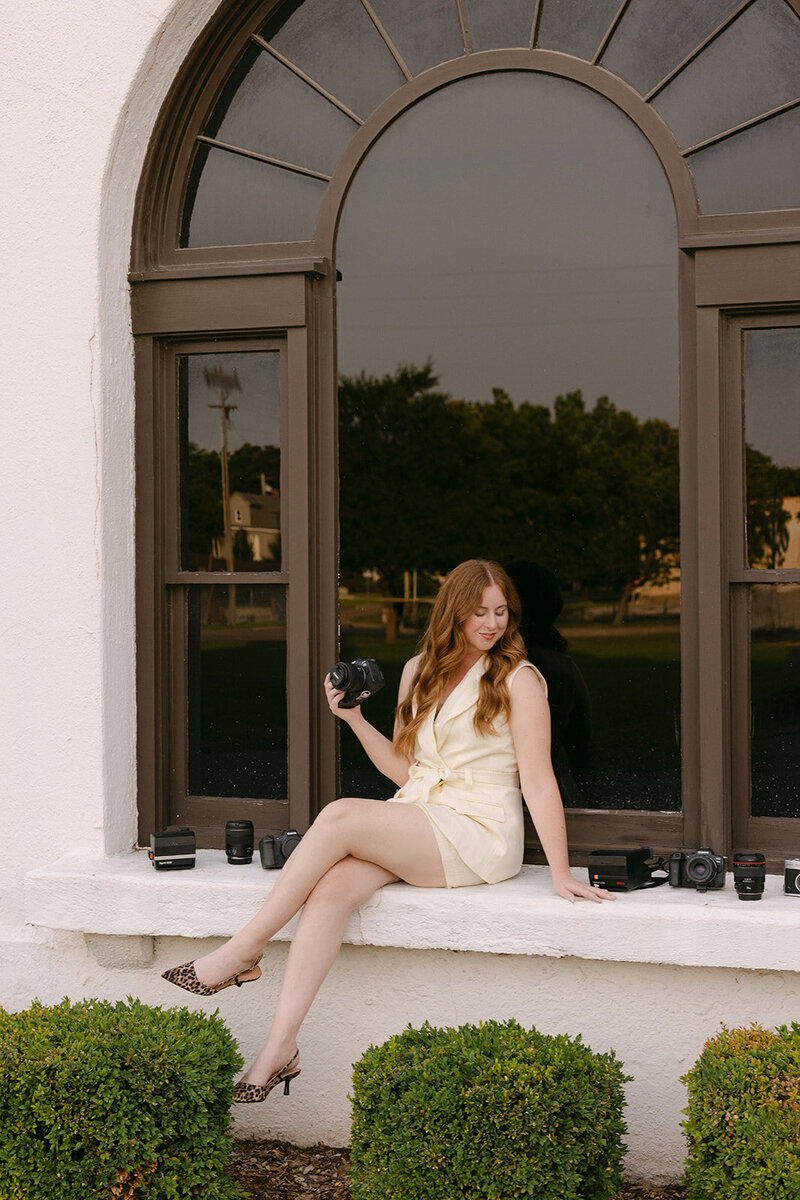 wichita wedding photographer and senior photographer ashley cole poses for branding photos