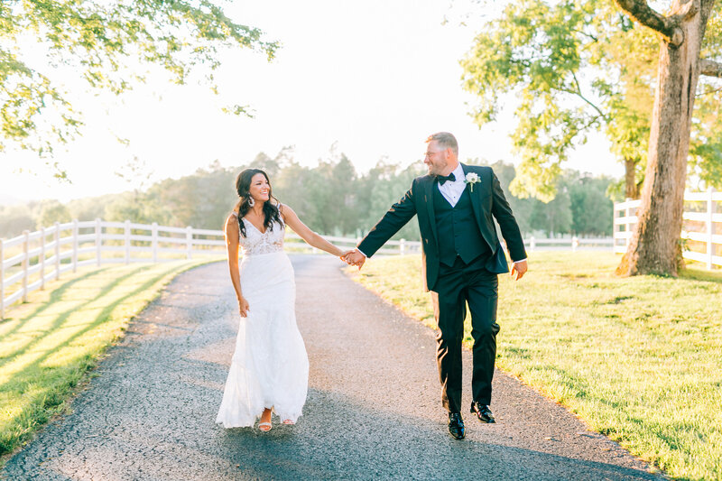 Bride and Groom walk hand in hand on country road, photo by Winx Photo, Tennessee Wedding Photographer