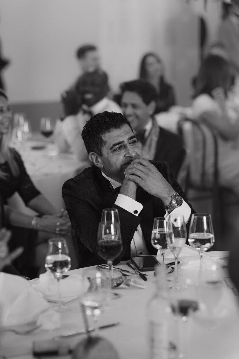 Wedding photographer captures couple taking a stroll hand in hand at their french chateau wedding.