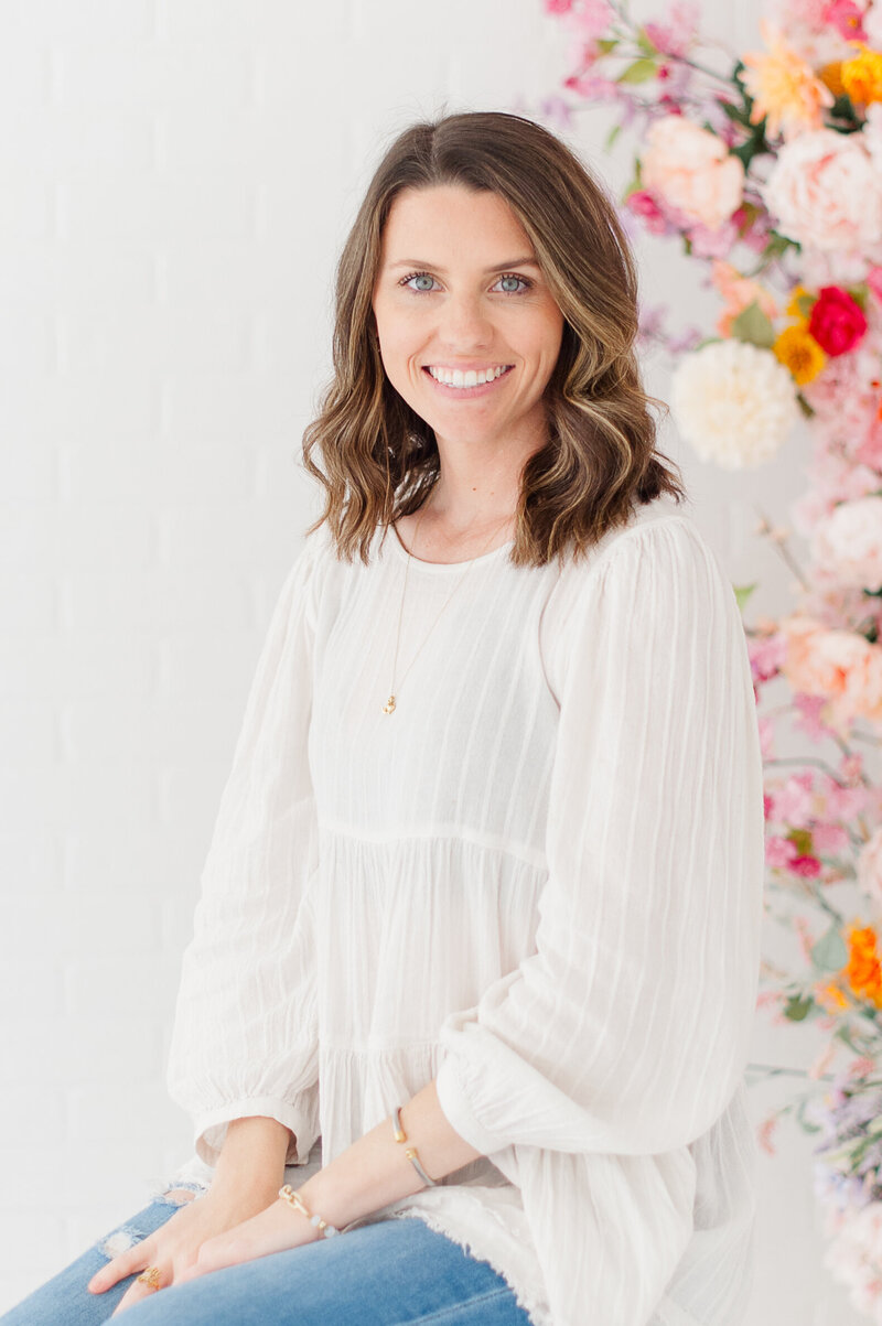 Photo of an award winning Orlando Engagement Photographer in a studio for a headshot