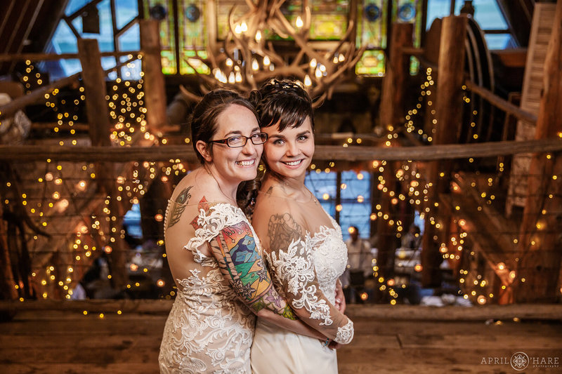 Beautiful wedding photo with stained glass window backdrop inside Barn at Evergreen Memorial Park