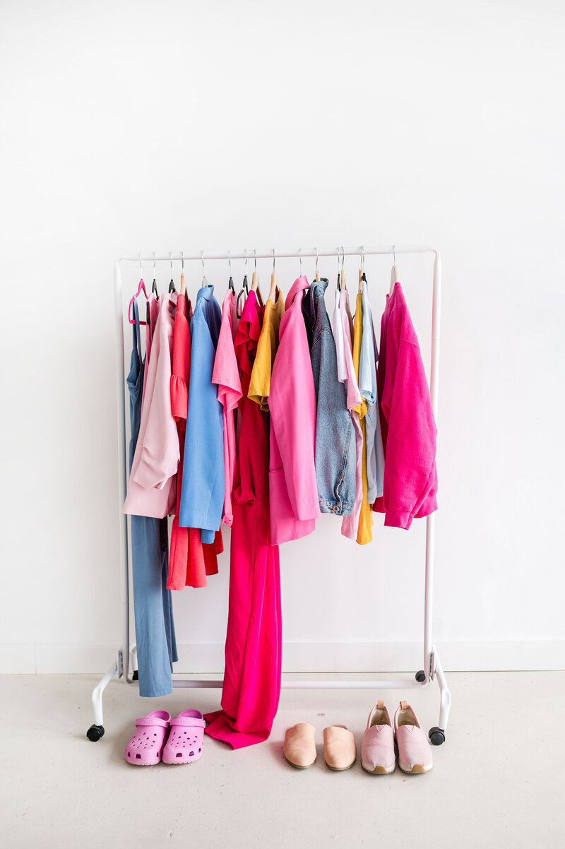 Clothing rack of brightly colored clothing