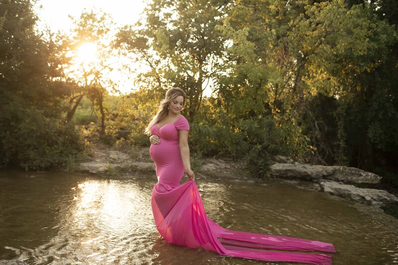 Mom posing in the lake during her pregnancy with Chunky Monkey Photography