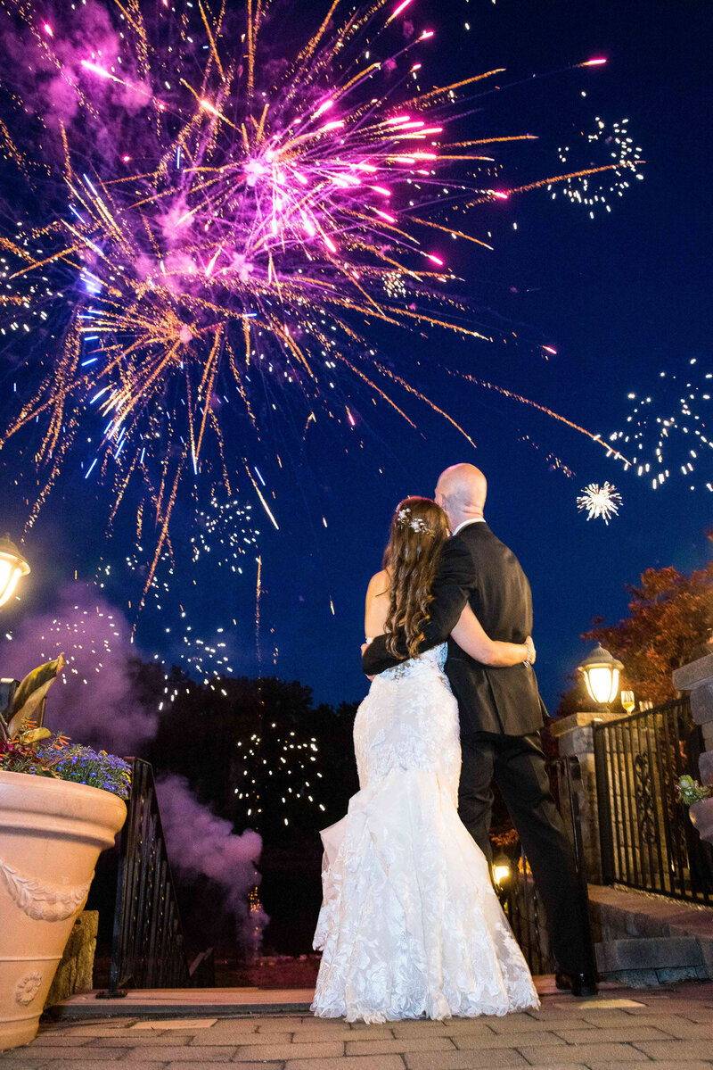 Bride and groom watching fireworks