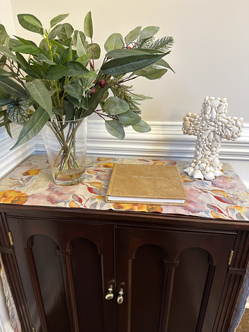 family portrait album promentely displayed in their homecrated by portrait studio charlotte nc