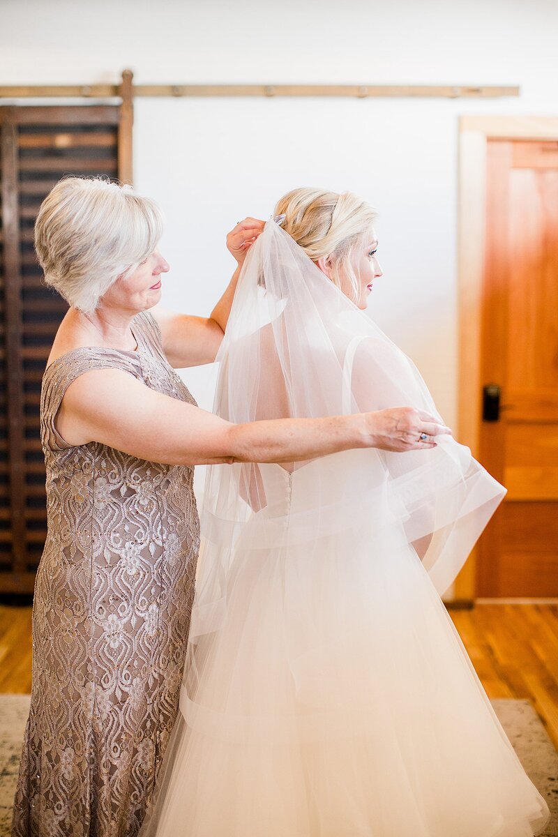 putting on the veil by Knoxville Wedding Photographer, Amanda May Photos
