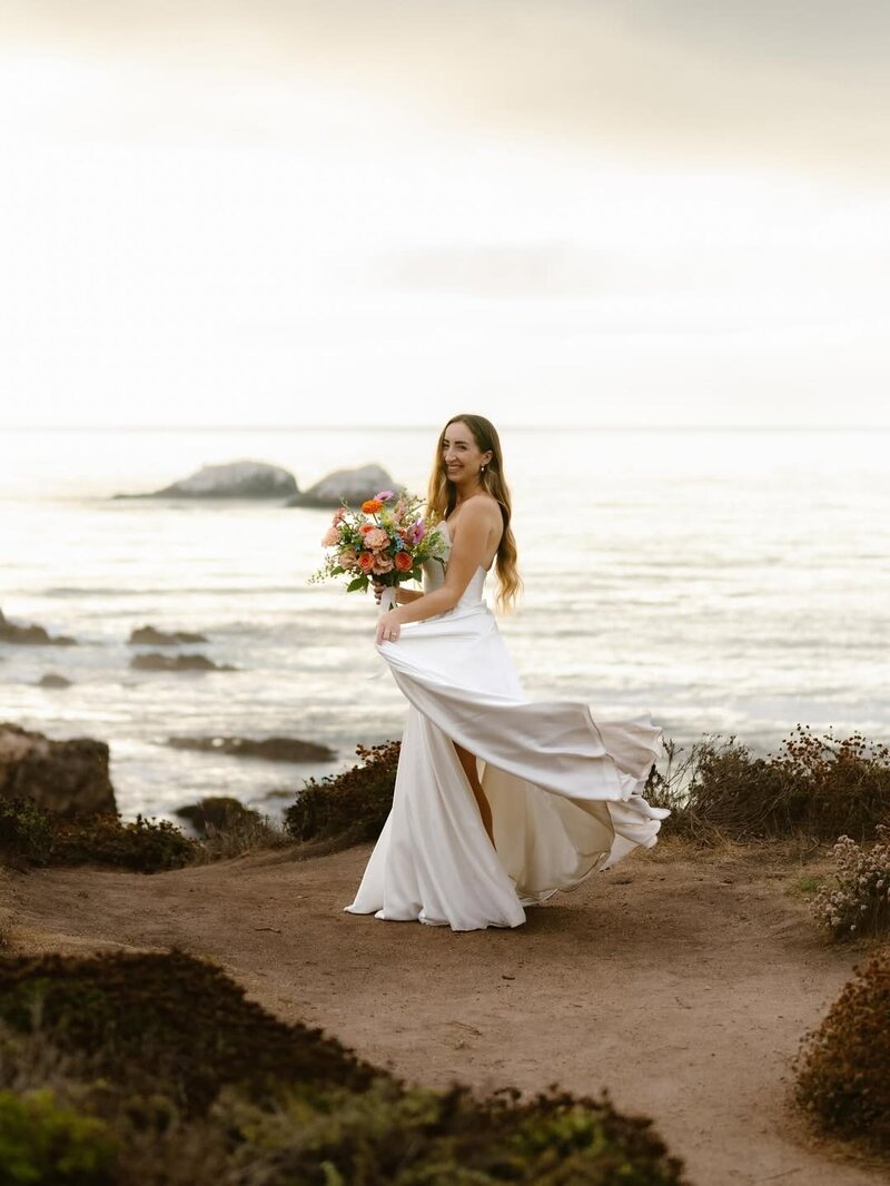 Bride holding a colorful summer bouquet at a Ventana Big Sur wedding