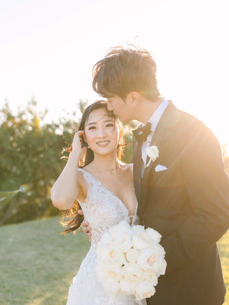 sunset with lens flare of bride and groom wedding photography portrait in palos verdes