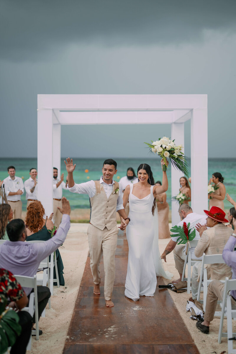 Rainy elopement style wedding at Dreams Vista Cancun in Mexico during winter.