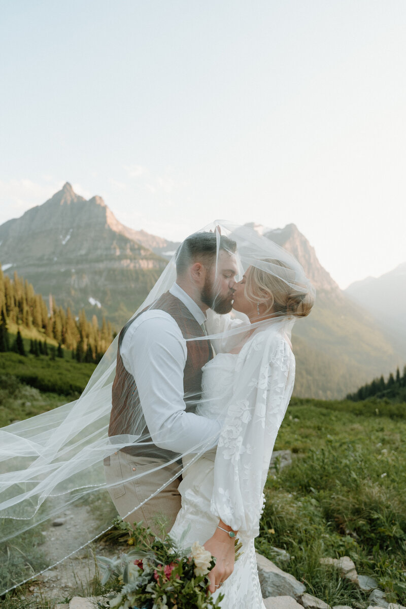 a couples saying their vows in colorado next to a river