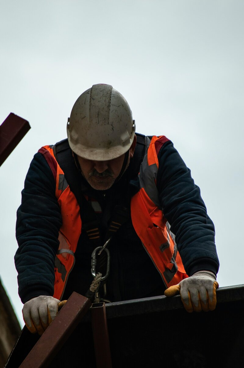 Frontline worker in PPE preparing for a shift, representing leadership in action