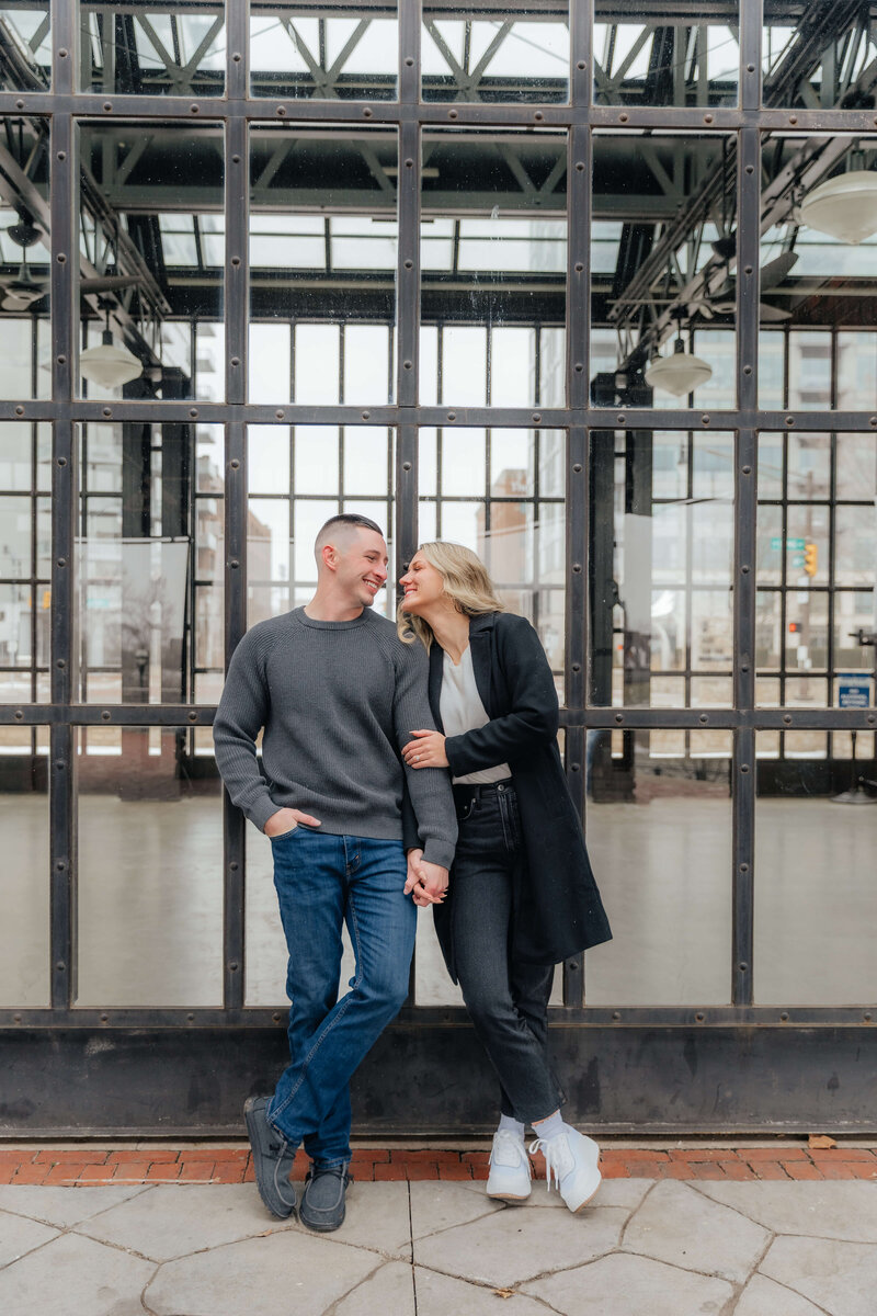 Urban engagement session with a modern, candid vibe by a Midwest wedding and couples photographer serving Michigan and Ohio, ideal for city-loving couples planning their session.