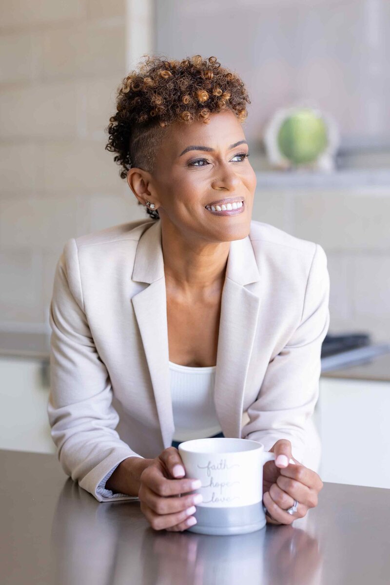 Brand photography that tells your story, featuring a confident coach in a white suit captured for a personal branding gallery.