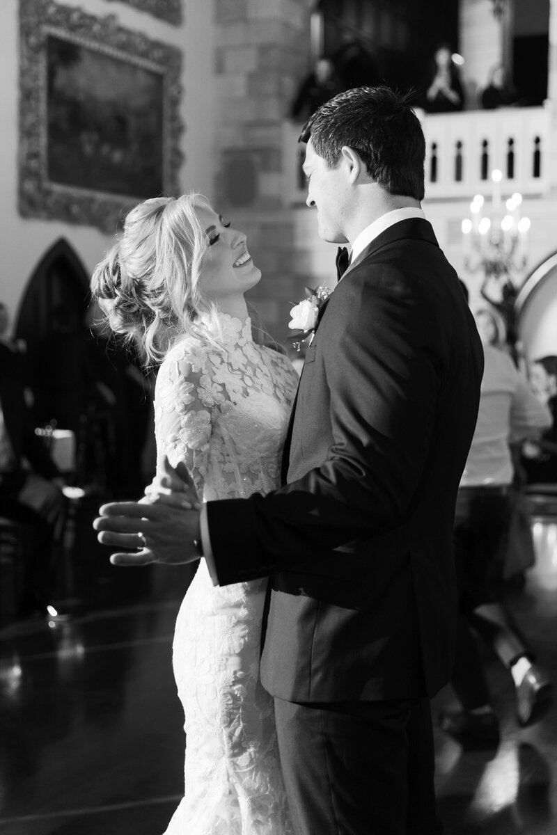 Wedding at Dover Hall in Manakin-Sabot, VA | Wedding Photographer in Richmond | black and white image of bride in floral lace dress sharing a dance with her groom in the ballroom of Dover Hall Estate in Richmond.