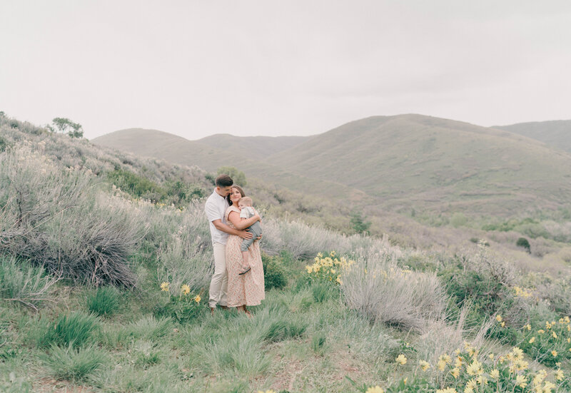 Mountain maternity session with glowing mom holding baby bump under soft light. CAPTURED BY Newborn Photography Salt Lake City, Newborn Photographer Riverton, Maternity Photographer Salt Lake City.