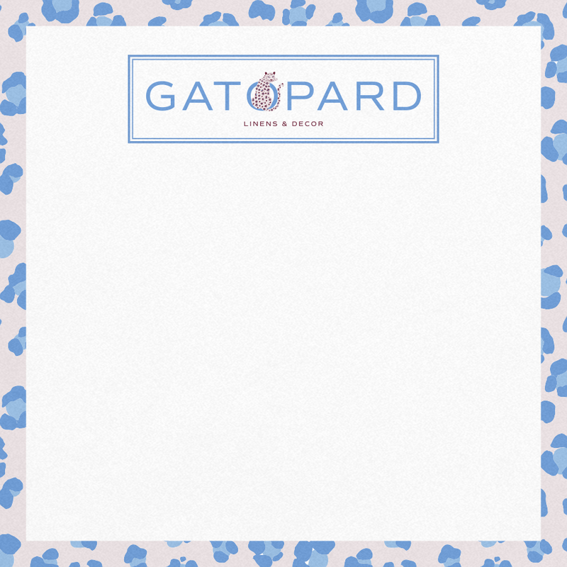 Square stationary with blue-toned leopard print on blush background border and Gatopard Linens & Decor logo