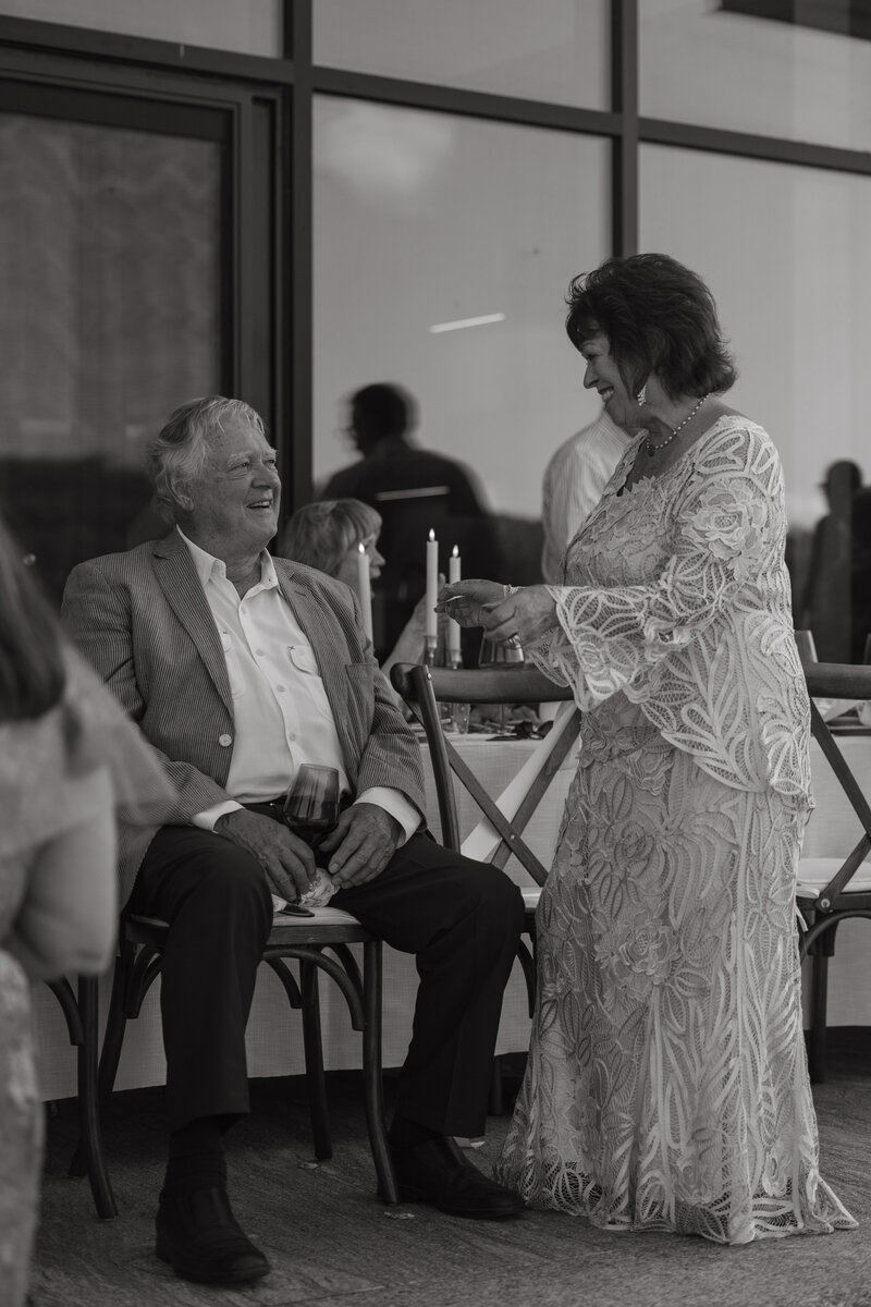 grandparents laughing at their grandsons wedding