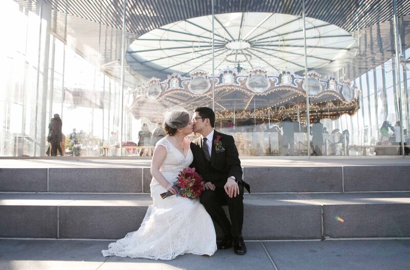 Bride and groom kissing Brooklyn Bridge, Dumbo Park carousel