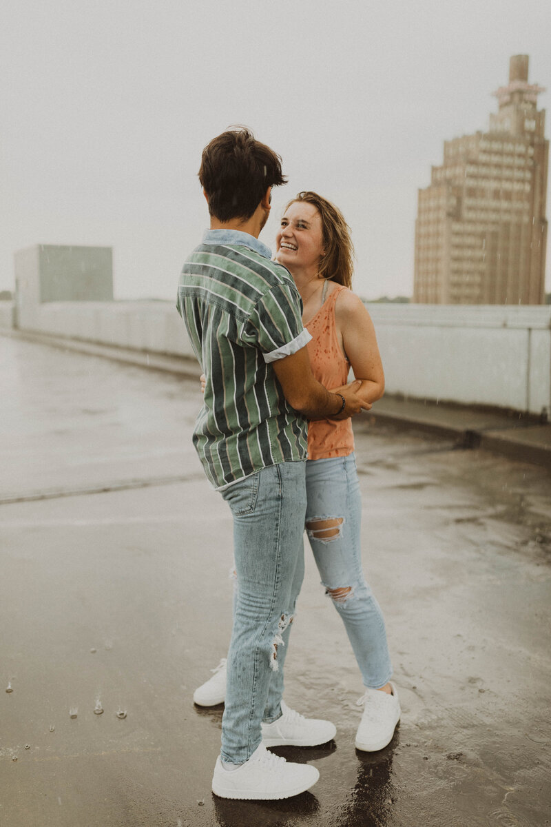 couple laughing and holding each other