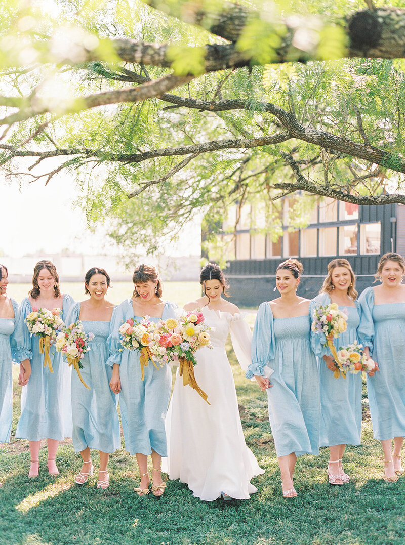 bride and bridesmaids with blue bridesmaid dresses