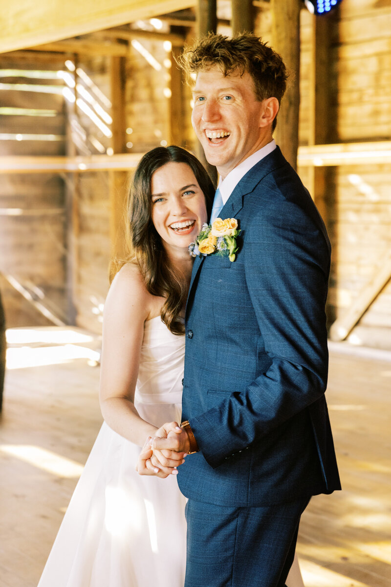 The happy couple smile towards their guests during their first dance as bride and groom, captured by destination photographer My Sun and Stars Co.