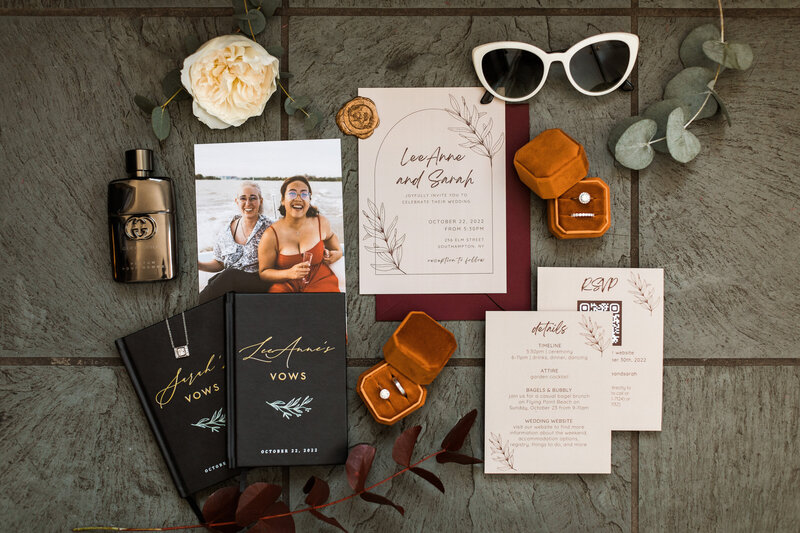 fall wedding flat lay invitation suite vow books