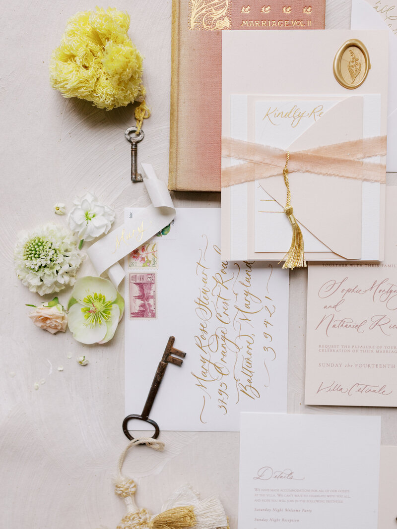 closeup of bridal invitation flatlay at Villa Cetinale in Italy