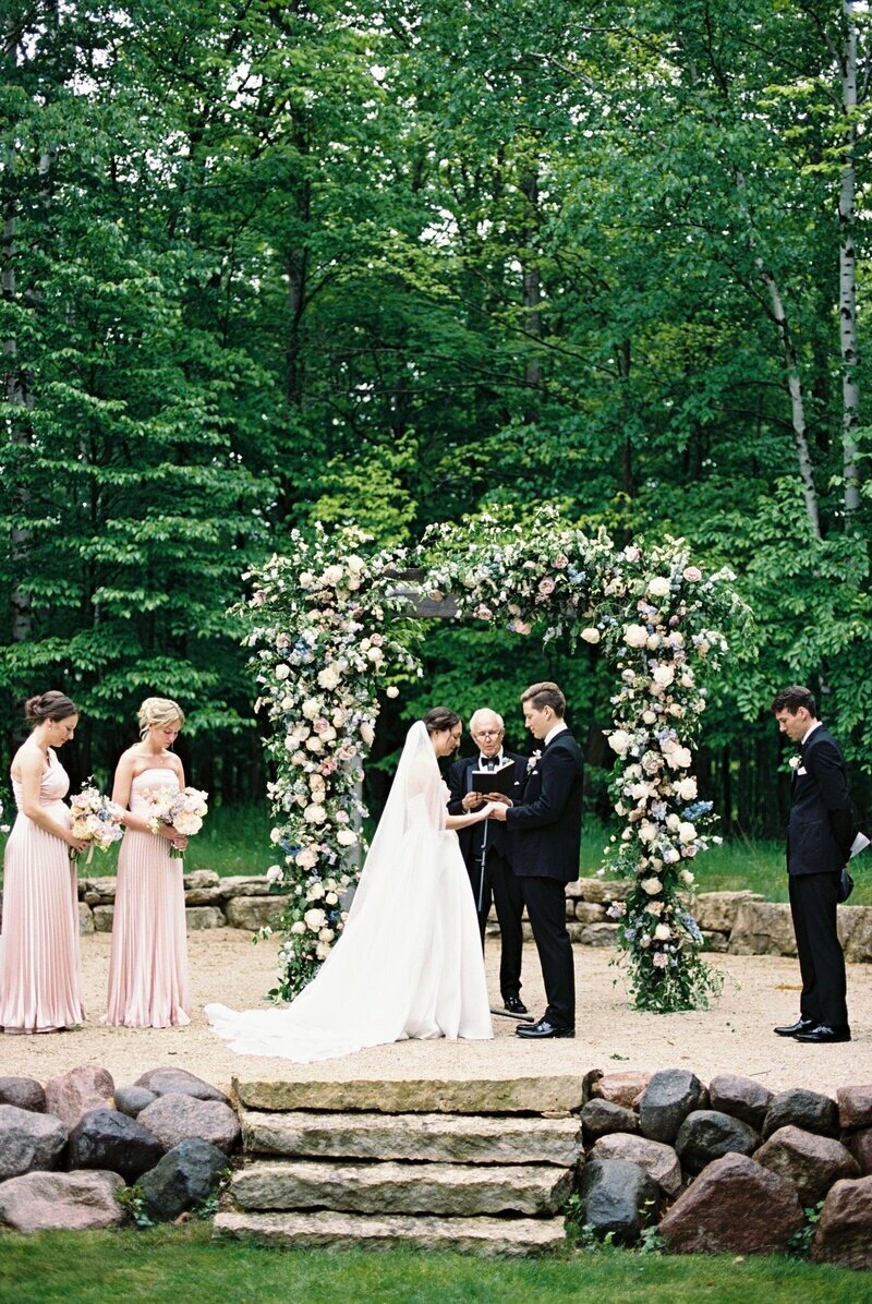 Bride and groom exchanging vows during their wedding ceremony, beautifully captured by Milwaukee wedding photographer Emily Barbara.
