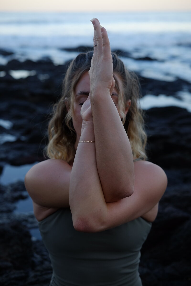 yoga woman in twisted arms pose