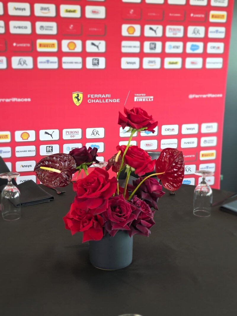 modern premium table vase flowers in shades of red for Ferrari