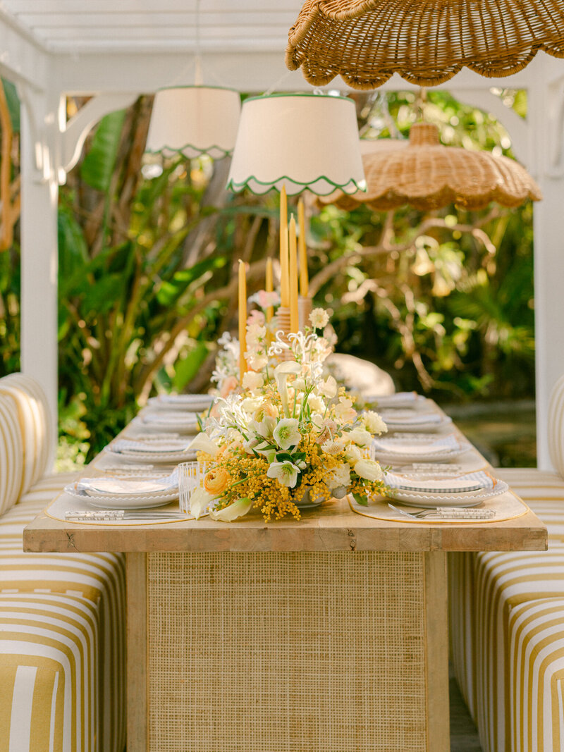 Basking in the golden glow of a citrus summer at the iconic Bahia Resort in San Diego, I had the absolute pleasure of capturing a scene of serene elegance. Tucked away in a secluded tropical garden, a charming pergola set the stage for beautifully arranged florals and meticulously styled table settings—a true mid-century retreat infused with modern whimsy. Every detail, from the vibrant citrus accents to the delicate blossoms, spoke of timeless sophistication and effortless charm. 