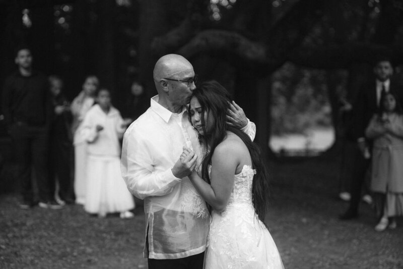 Elopement Reception Ideas | Bride cries into her father's shoulder as he kisses her on the head during their first dance