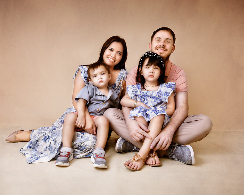 maternity photoshoot holding a yellow flower