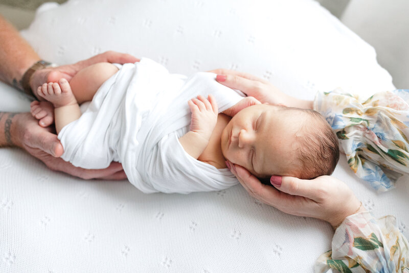 stunning image of a mom hugging her newborn baby boy during newborn photos at home in virginia beach