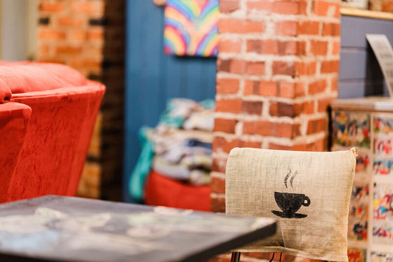 chair and table with brick pillar in the background