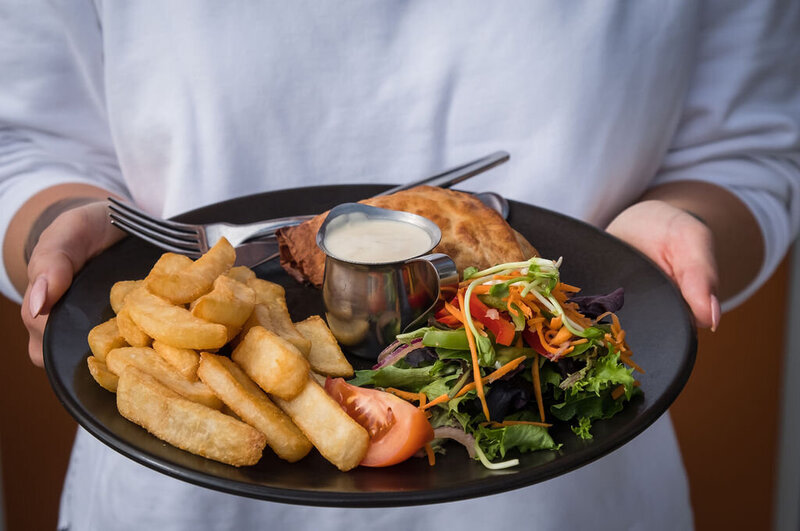 Chicken Parma with salad and chips served at Saltwater Bistro