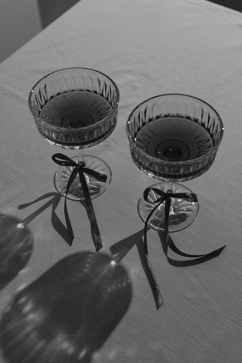 kaboompics_elegant-toast-vintage-wine-glasses-with-red-ribbon-accents-34637