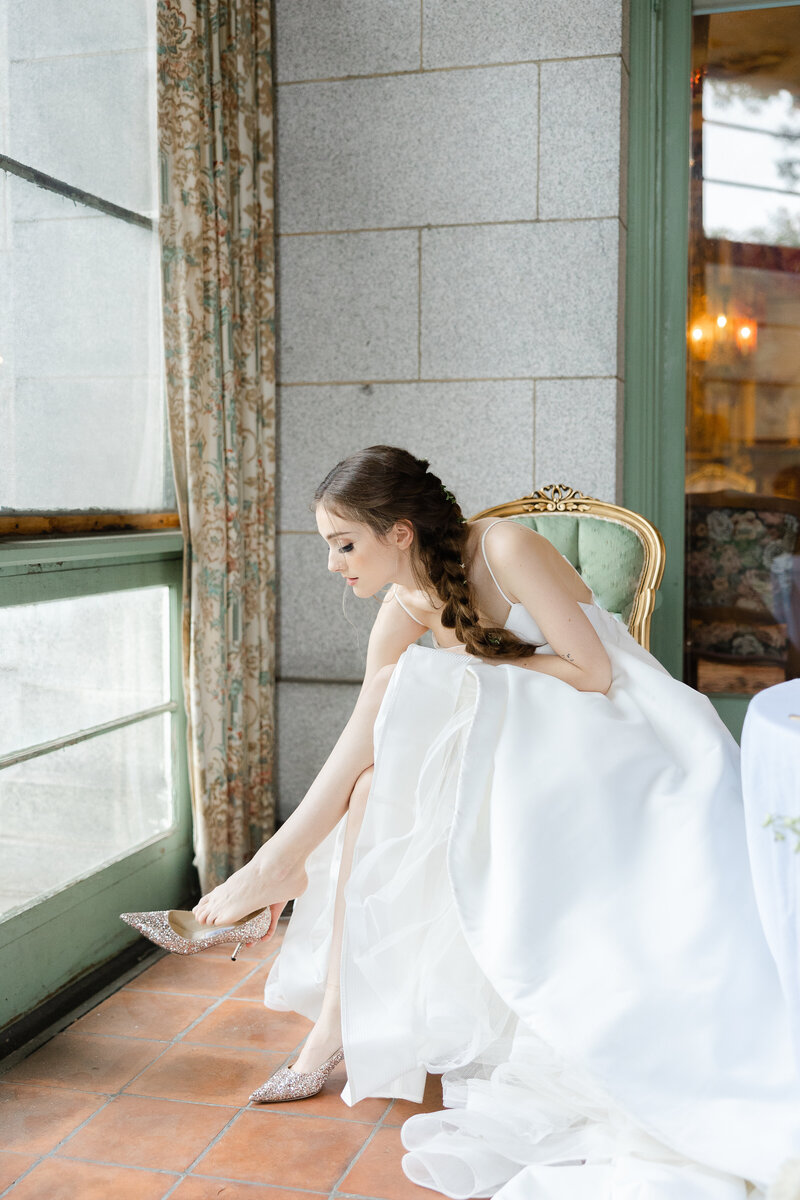 bride putting on her shoes