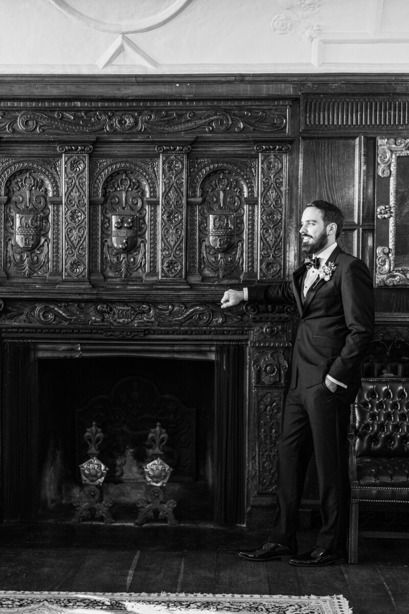 Wedding Photographer Atlanta Georgia | Groom By The Fireplace At Mansion Wedding Venue